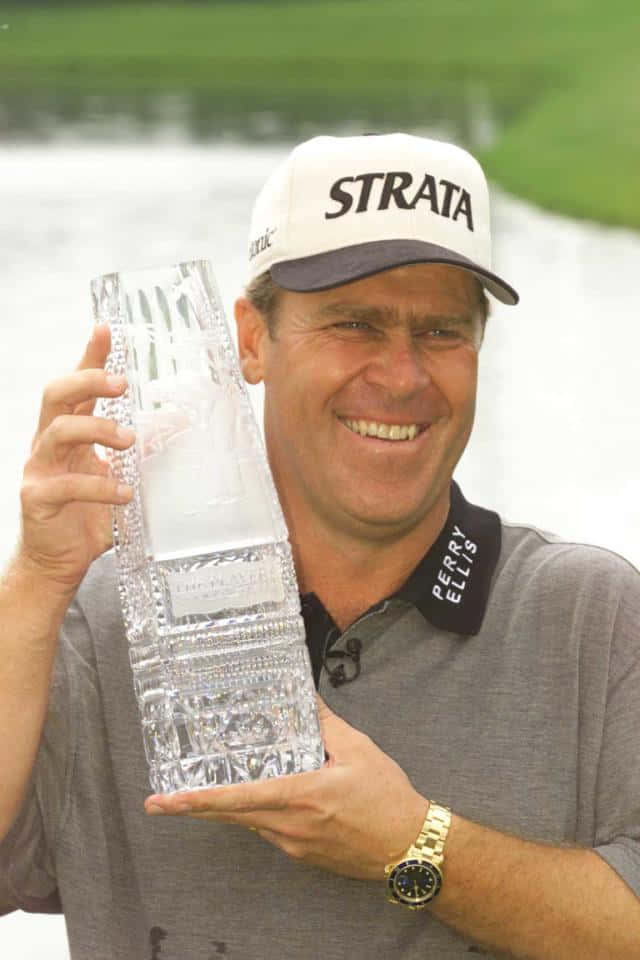 Hal Sutton Holding A Glass Trophy Wallpaper