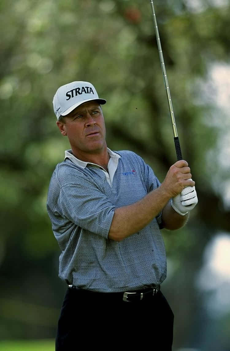 Hal Sutton Holding Up A Golf Club Wallpaper