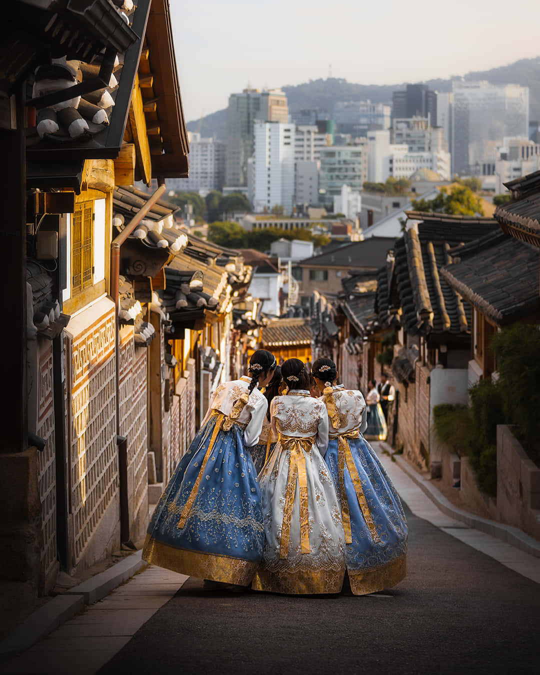 Hanbok Clad Women In Bukchon Hanok Village Wallpaper