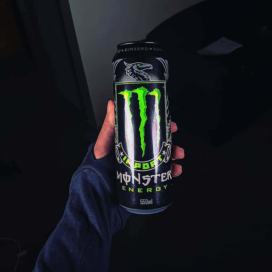 Hand Holding Monster Energy Can Wallpaper