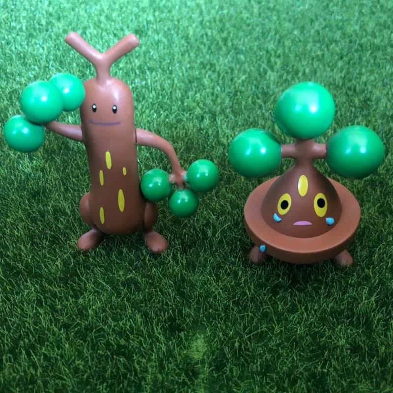 Happy And Sad Sudowoodo Figurines Wallpaper