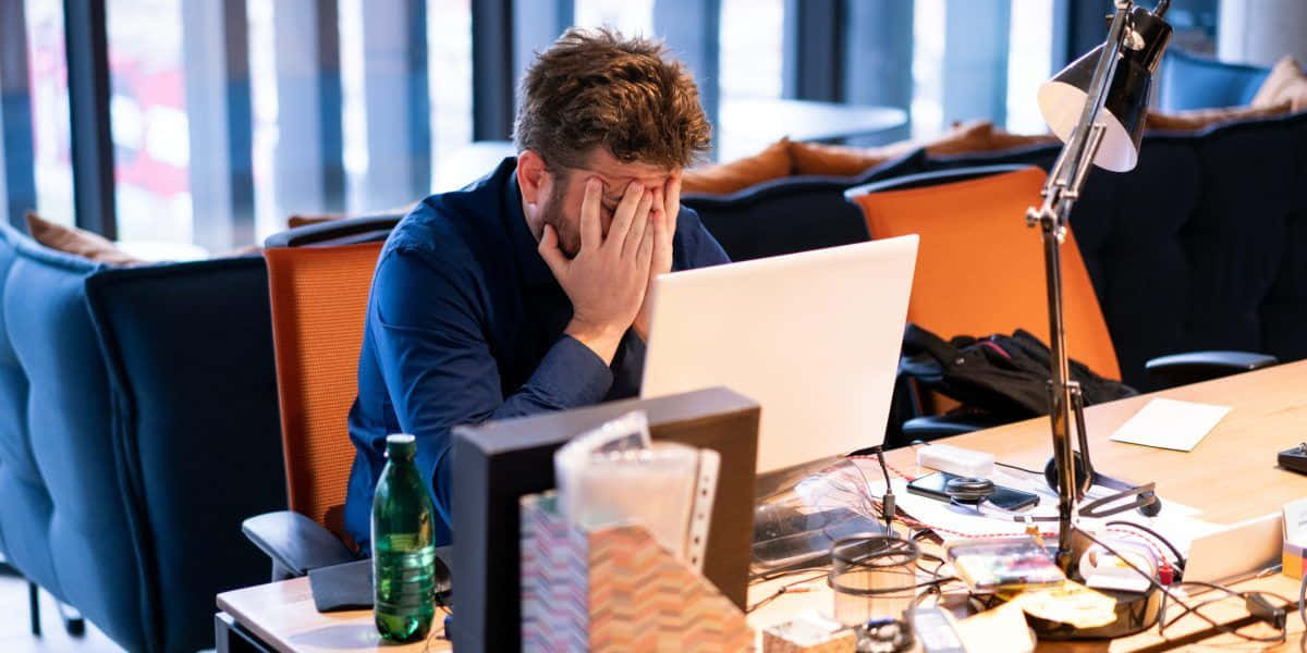 Hardworking Young Man With Blue Collar Wallpaper