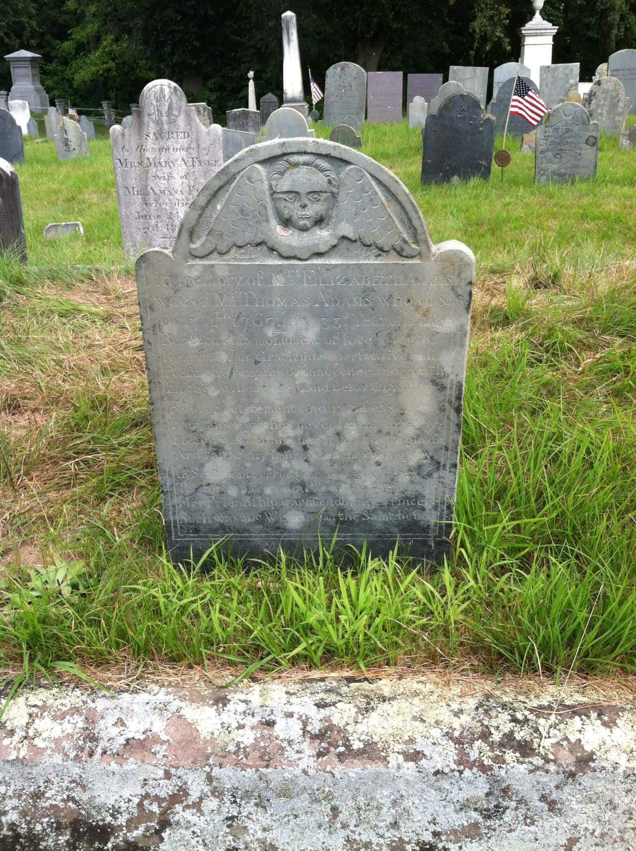 Haunting Gravestone In A Peaceful Cemetery Wallpaper