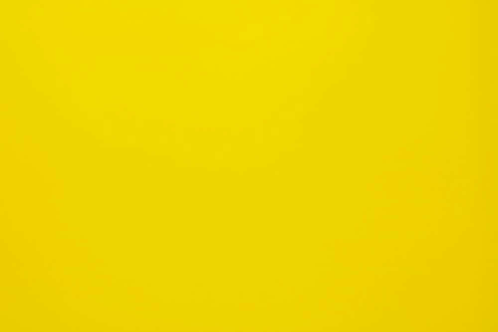 Have More Fun With A Pastel Yellow Laptop Wallpaper