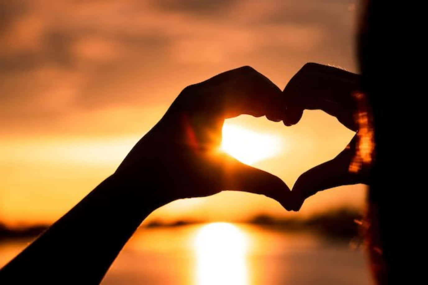 Heart Silhouette At Sunset Wallpaper