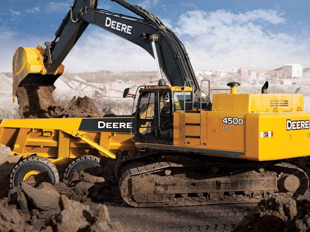 Heavy Duty Yellow Excavator At A Construction Site Wallpaper