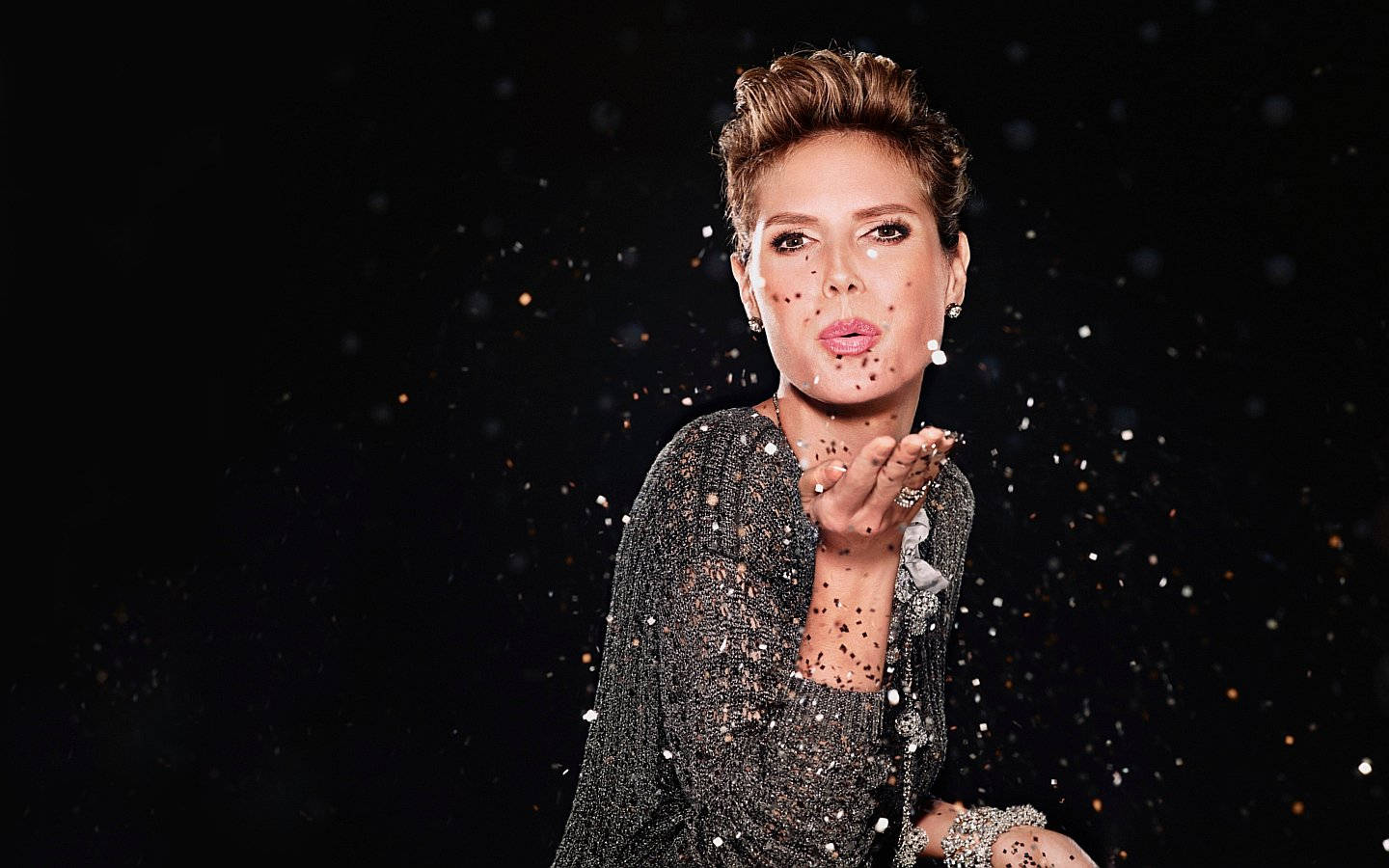 Heidi Klum Blowing Confetti Wallpaper