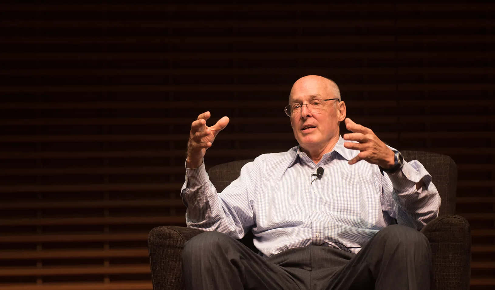 Henry Paulson Sitting In Armchair Wallpaper