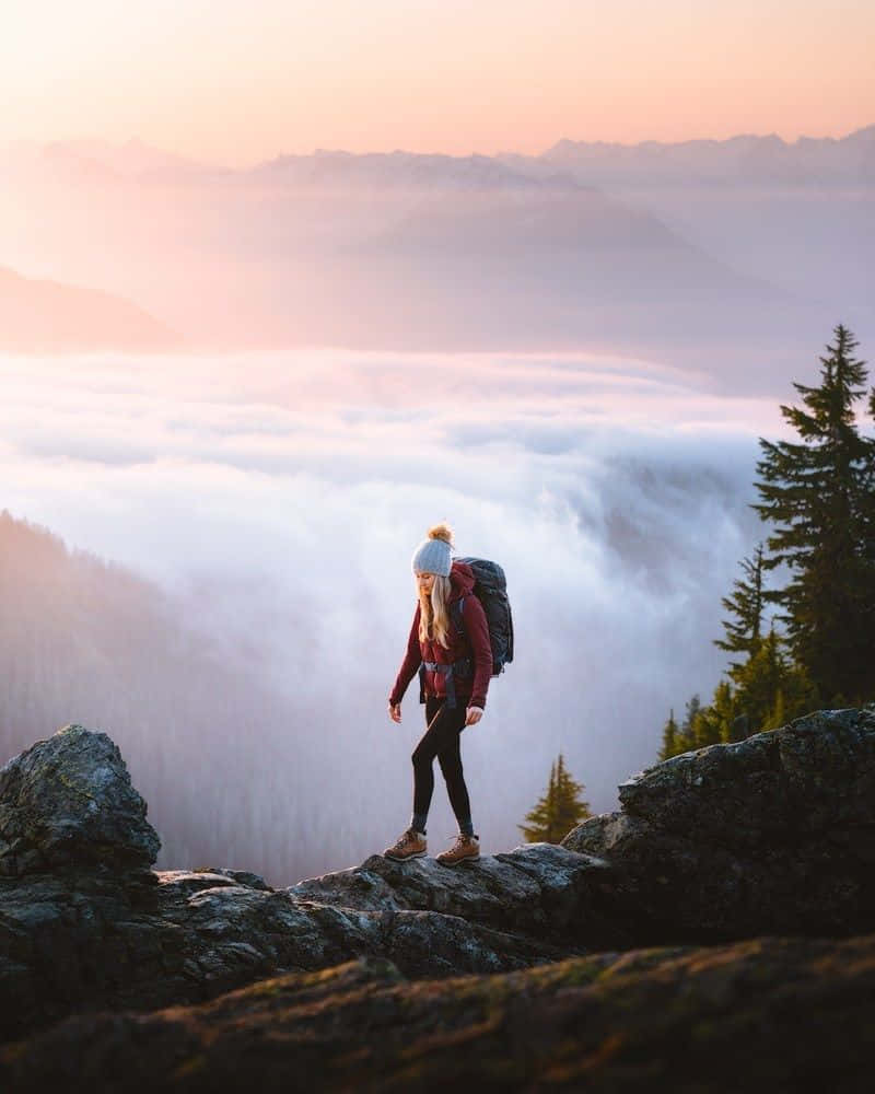 Hikers Embarking On A Thrilling Winter Adventure Wallpaper