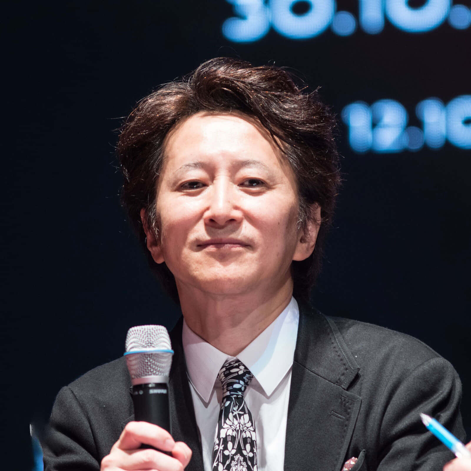 Hirohiko Araki Posing With His Artwork Wallpaper