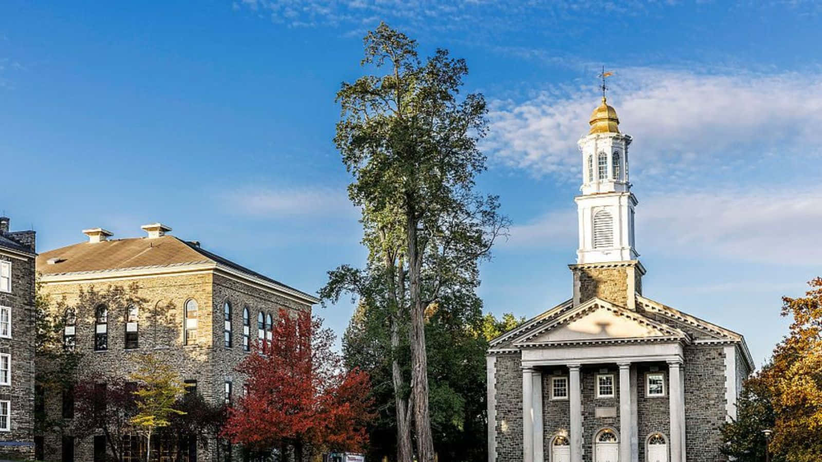 Historic College Buildingwith Clock Tower Wallpaper