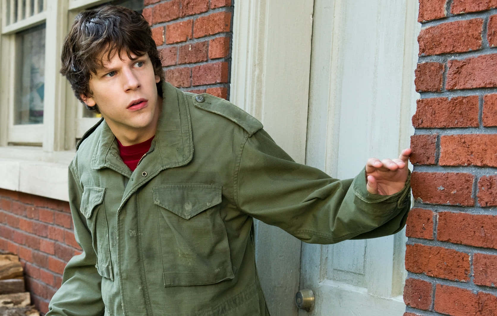 Hollywood Actor Jesse Eisenberg Looking Dashing In A Casual Outfit Wallpaper