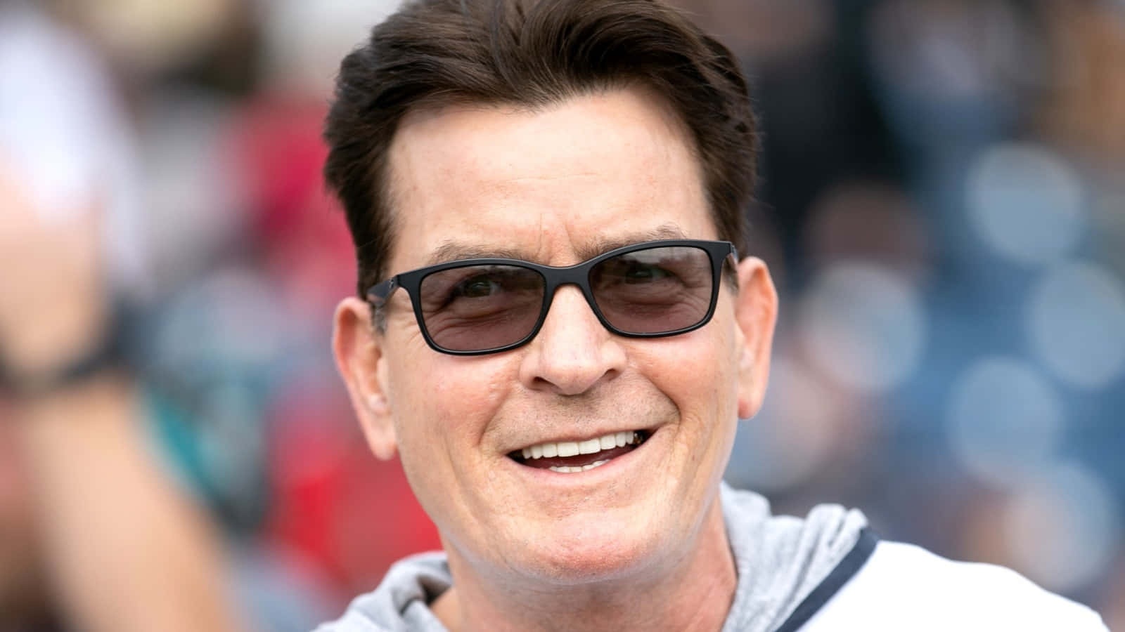 Hollywood Legend, Charlie Sheen In A Captivating Portrait Wallpaper