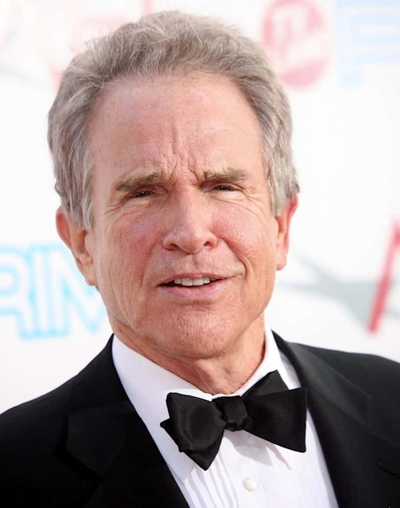 Hollywood Legend Warren Beatty Smiling In Classic Portrait Wallpaper