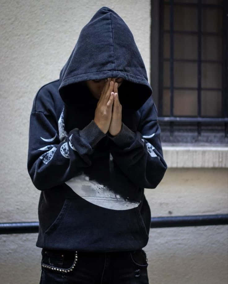 Hooded_ Figure_ Prayer_ Hands Wallpaper