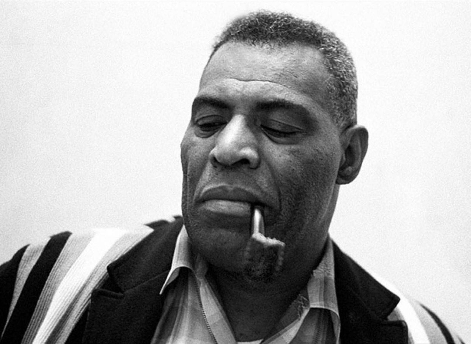 Iconic Blues Singer Howlin' Wolf Enjoying A Pipe Wallpaper