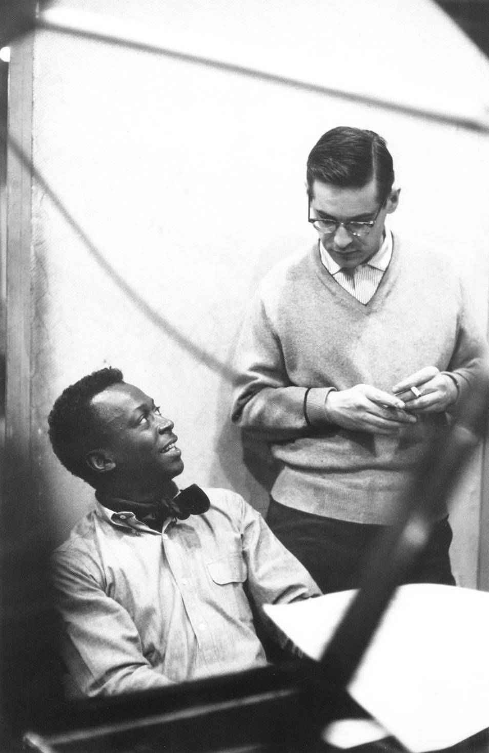 Iconic Duo - Miles Davis And Bill Evans In An Intimate Musical Moment Wallpaper