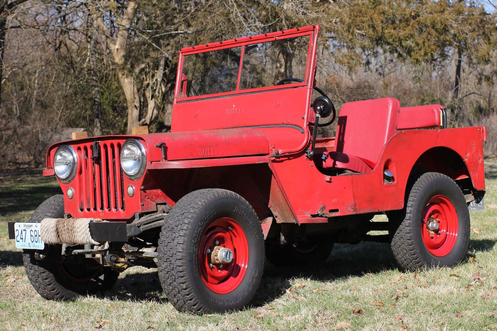 Iconic Jeep Willys In Natural Setting Wallpaper