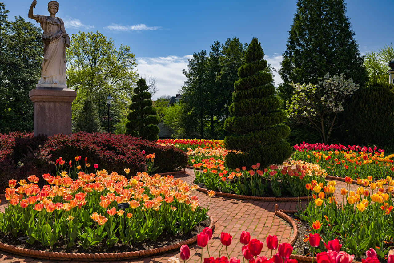 Idyllic Victorian Garden In Full Bloom Wallpaper