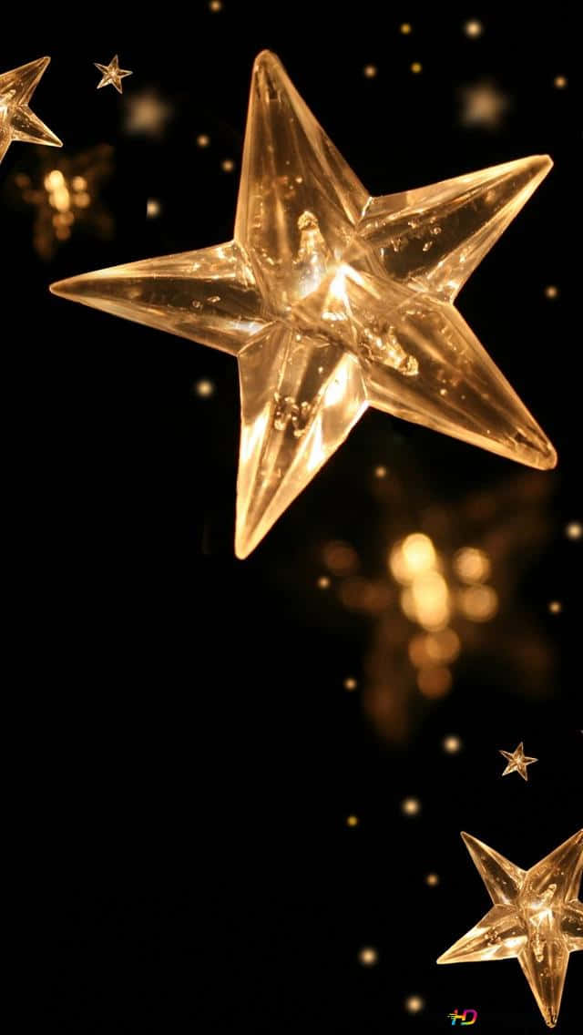 Illuminate Your Christmas Holidays With The Magical Sparkle Of A Star. Wallpaper