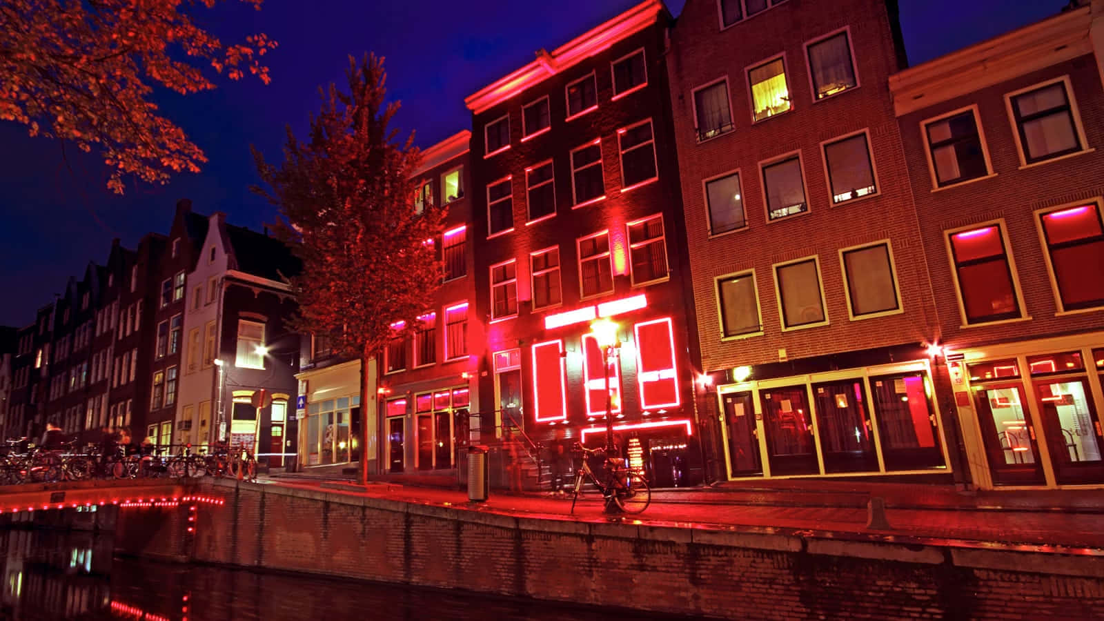 Illuminated Nightlife At The Red Light District Wallpaper