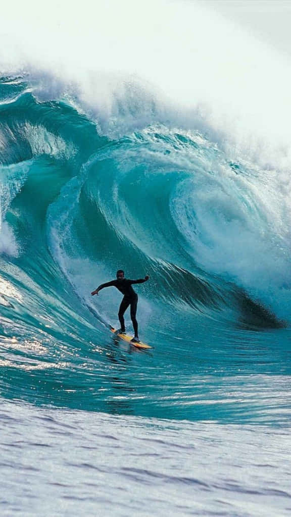 Image A Lone Surfer Catching Some Waves While Enjoying The Sunset With Their Iphone Wallpaper