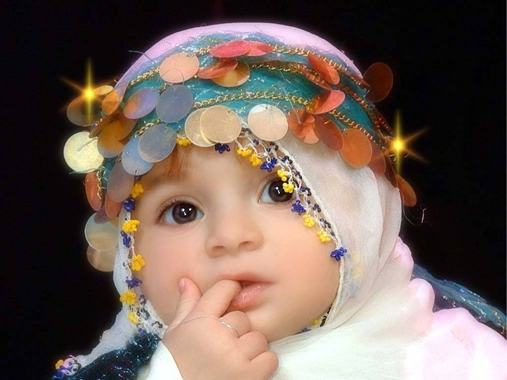 Image A Young Arab Baby Girl With Lush Hair And A Bow Headband Wallpaper