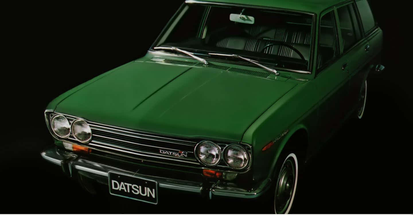 Immaculate Retro Style Datsun 510 In Park Wallpaper