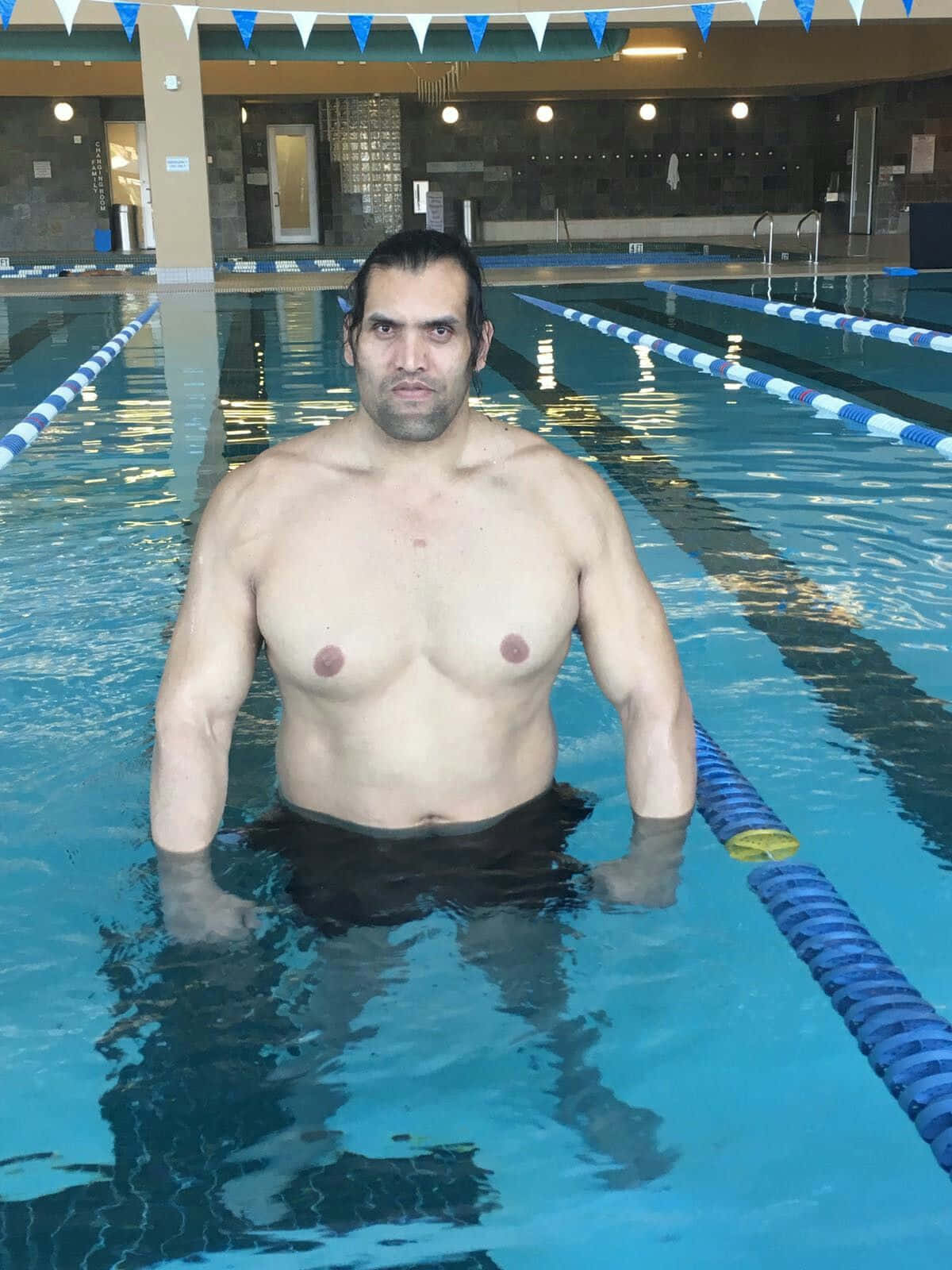 Indian Wrestler The Great Khali On A Pool Wallpaper