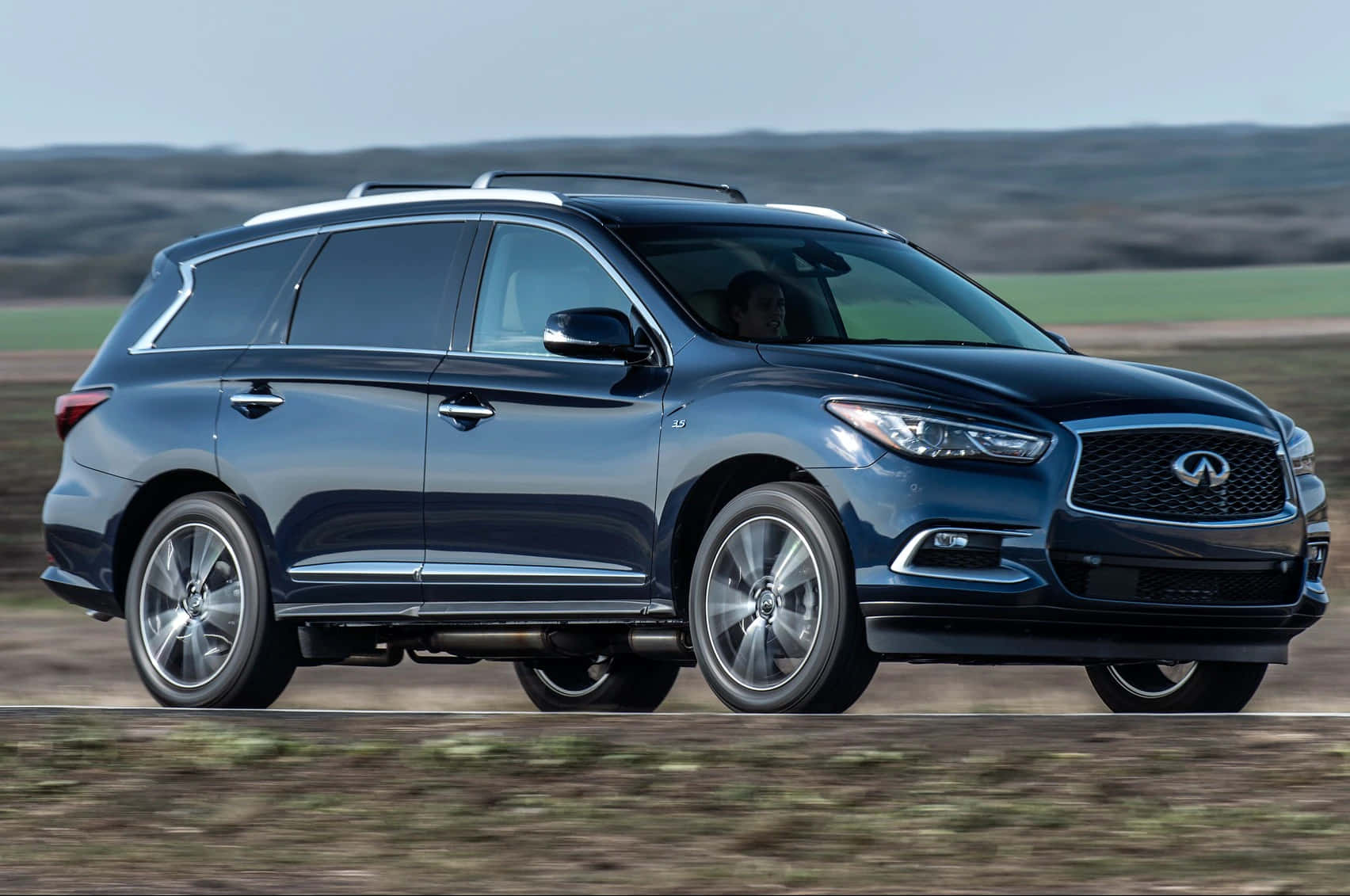 Infiniti Qx60 Luxury Suv On The Road Wallpaper