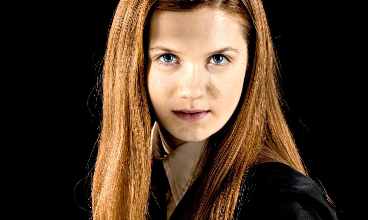 Inspiring Ginny Weasley In Her Gryffindor Uniform Wallpaper