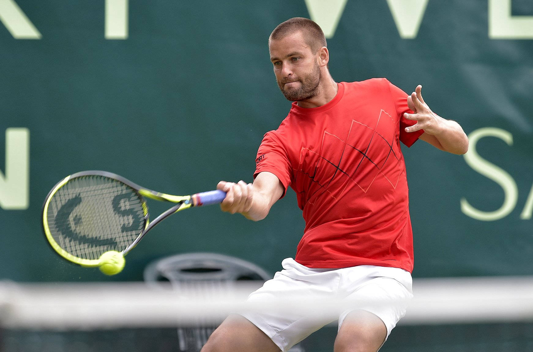 Intense Game - Mikhail Youzhny In Action On The Court Wallpaper