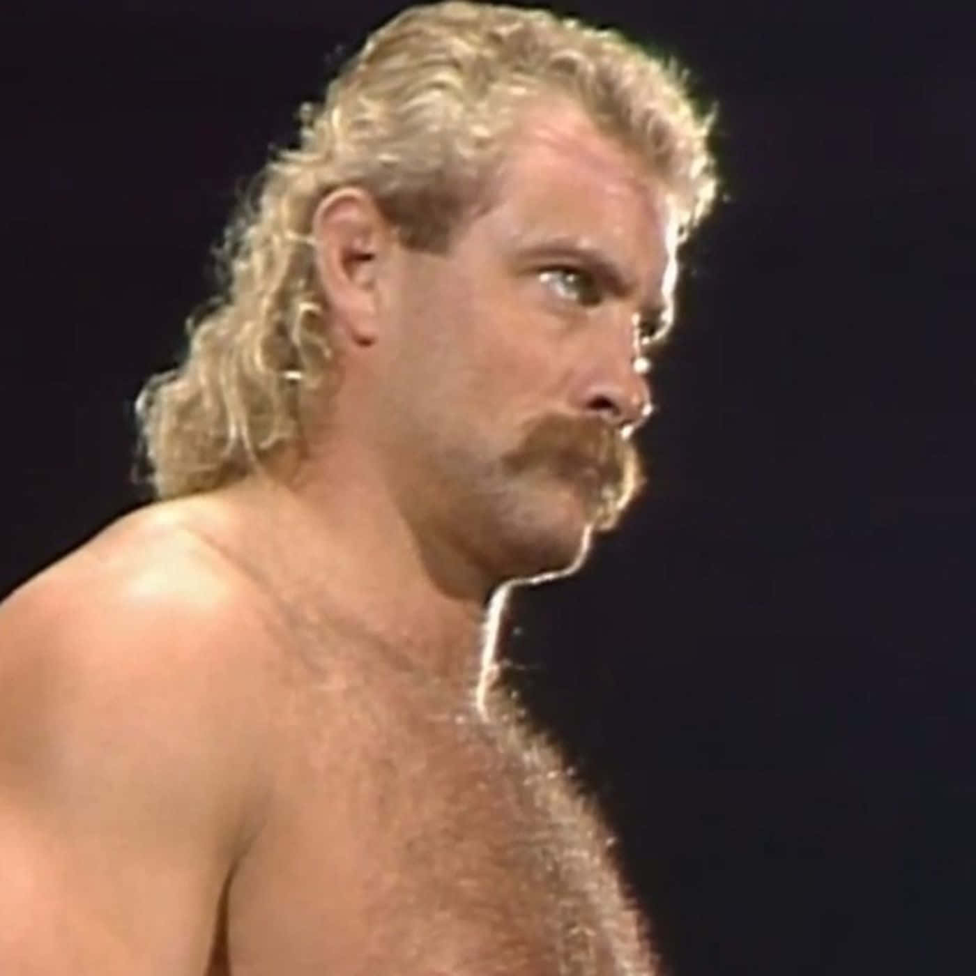 Intimidating American Wrestler Magnum Ta Side View Shot Wallpaper