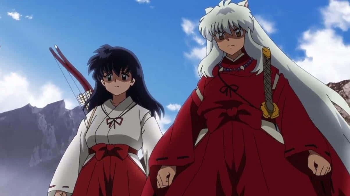 Inuyasha And Kagome Share An Intimate Moment Under The Moonlight. Wallpaper