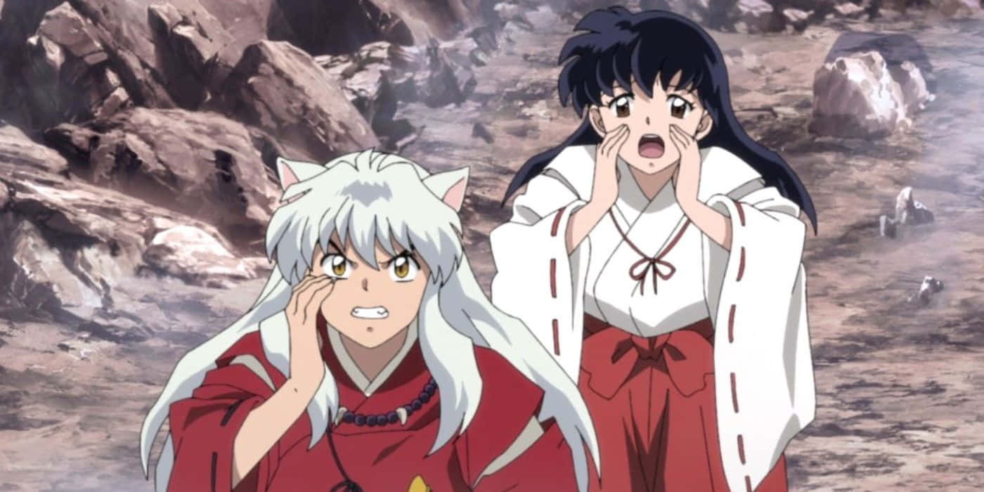 Inuyasha And Kagome Sharing A Magical Moment Wallpaper