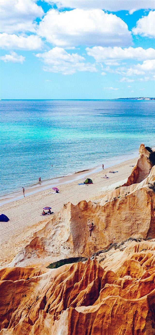 Iphone X Beach And Rocks Wallpaper