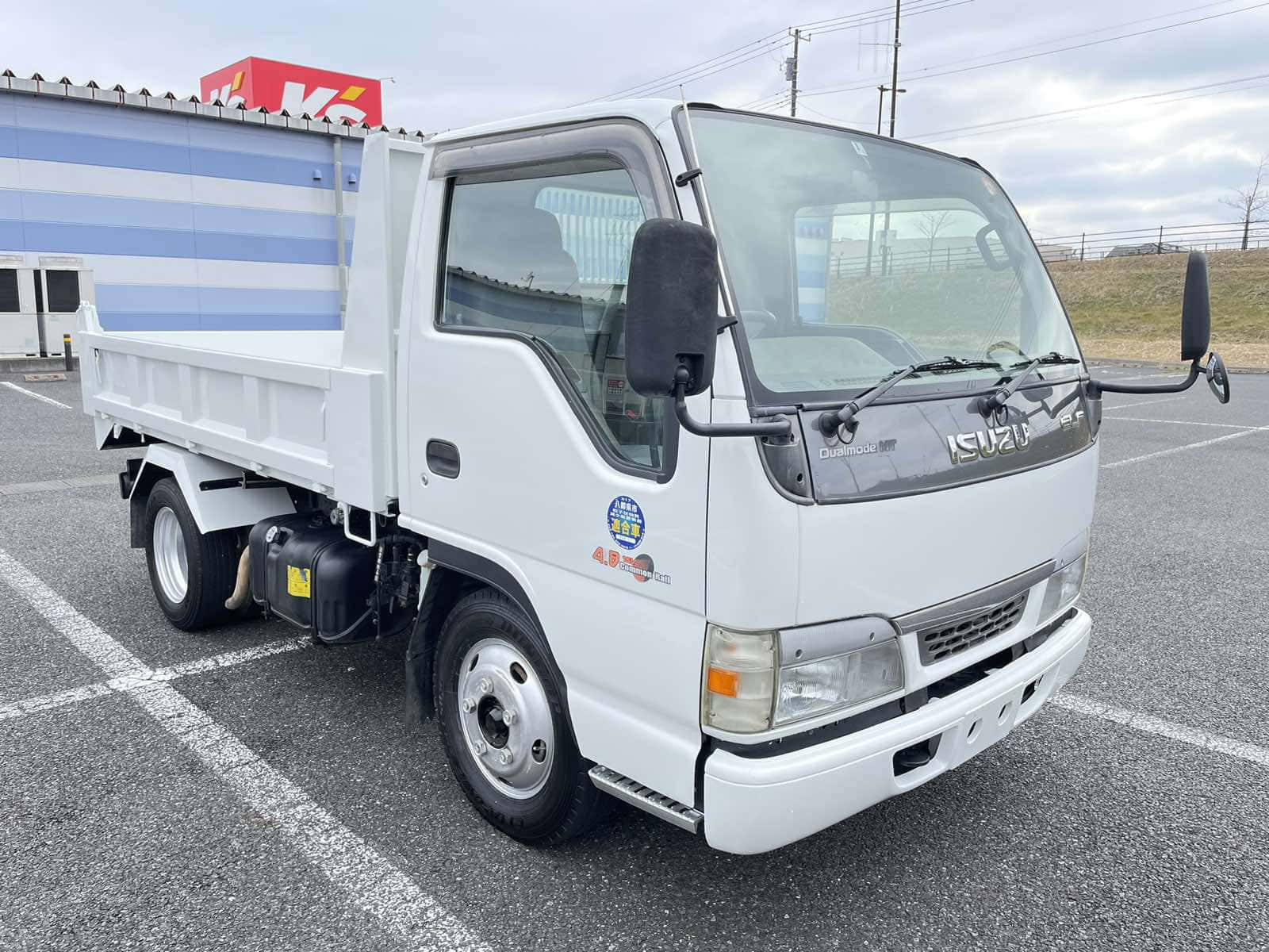 Isuzu Elf White Truck Parked Wallpaper