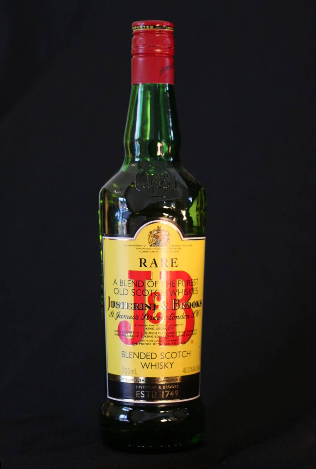 J&b Rare Bottle Over Black Background Wallpaper