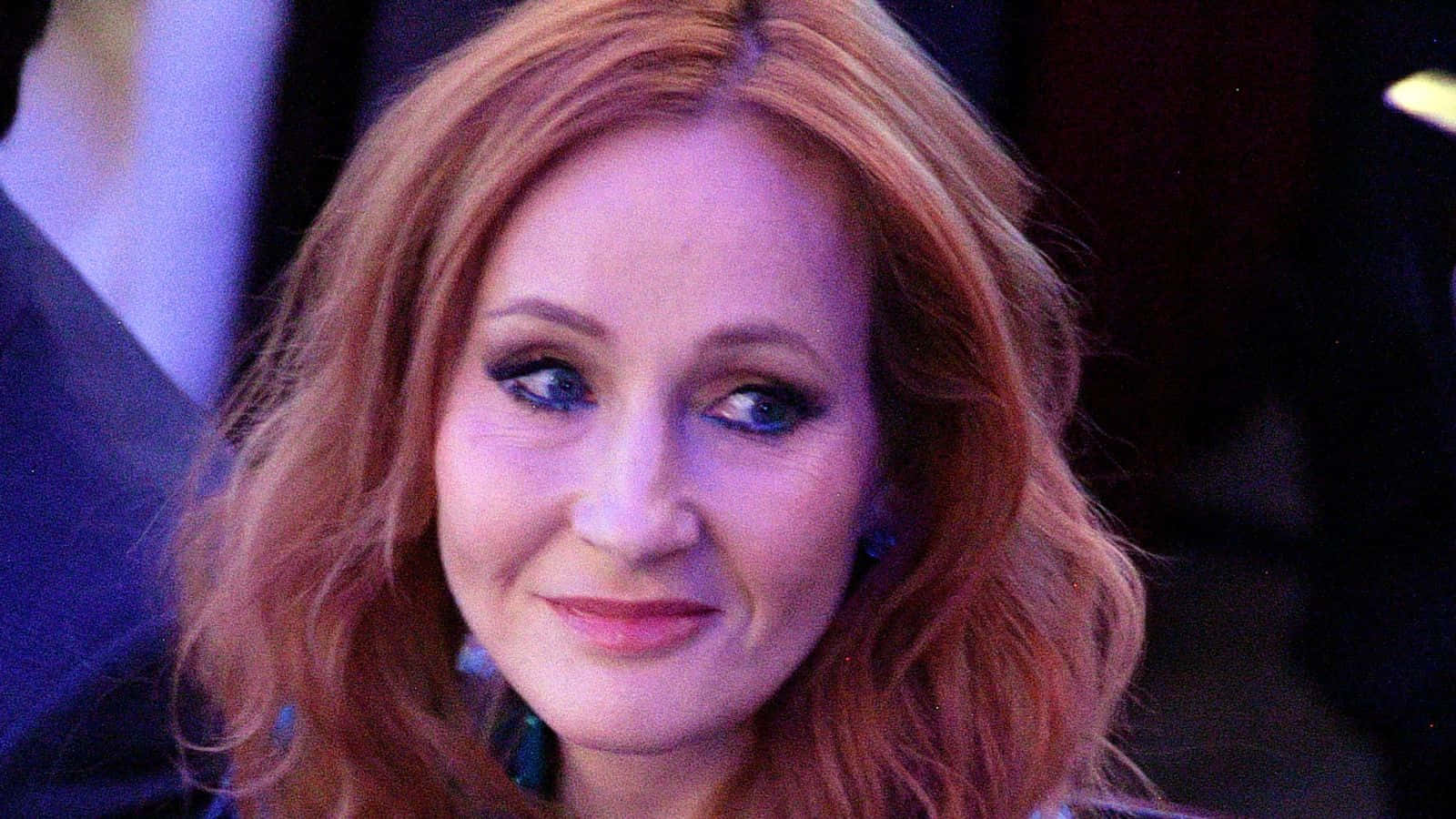 J.k. Rowling Smiling During An Interview Wallpaper