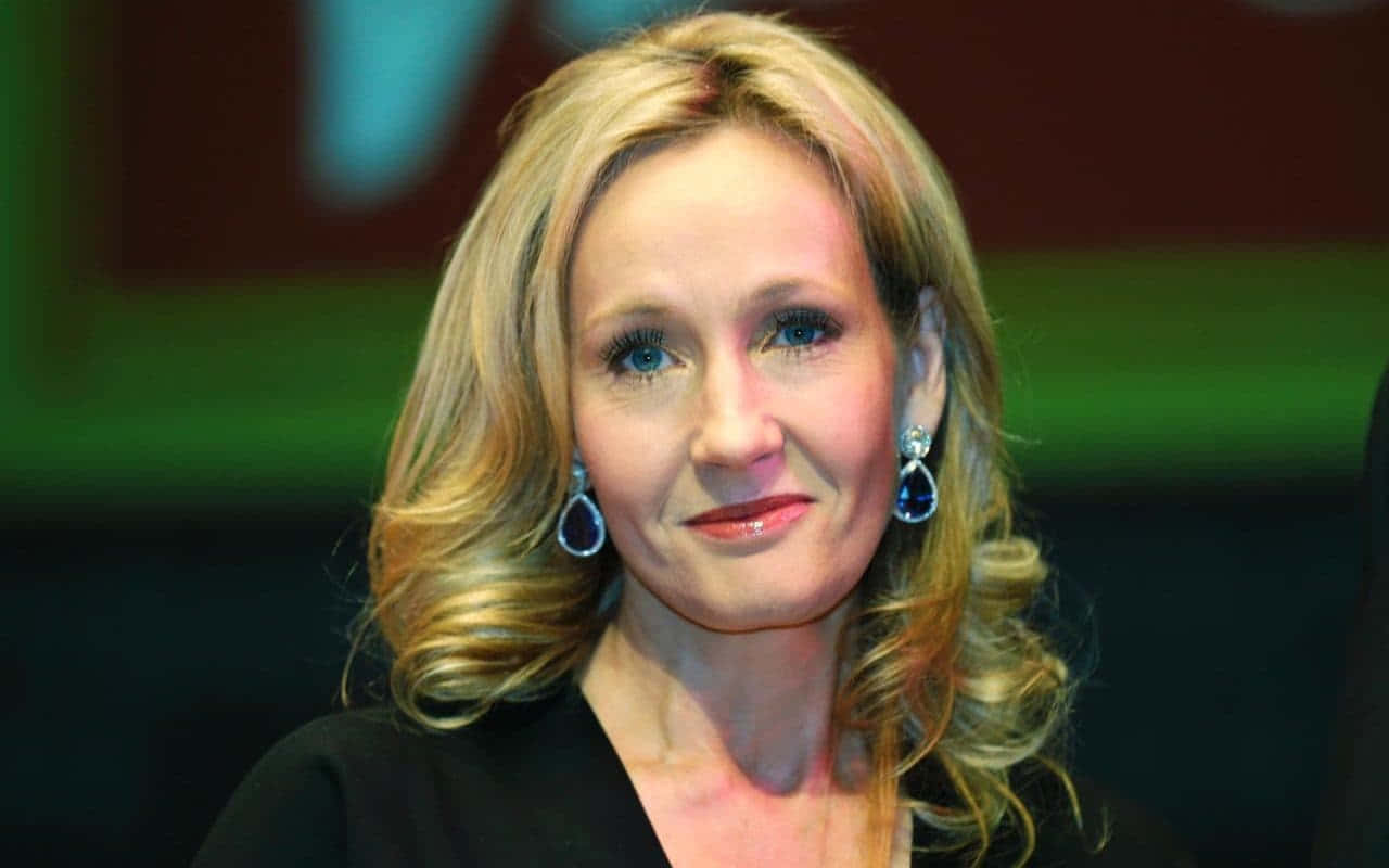 J.k. Rowling Smiling During An Interview Wallpaper