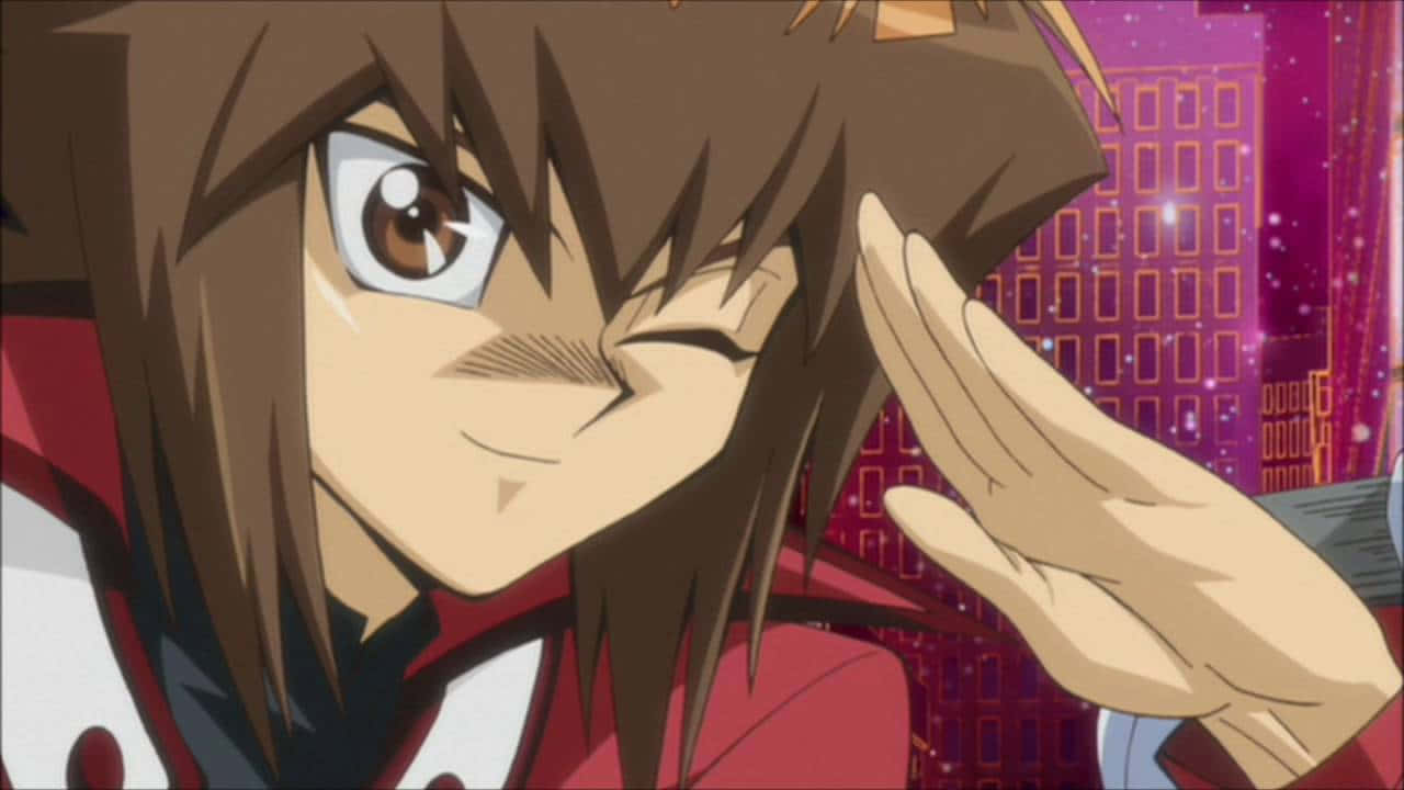 Jaden Yuki Striking A Confident Pose In His Duelist Uniform Wallpaper