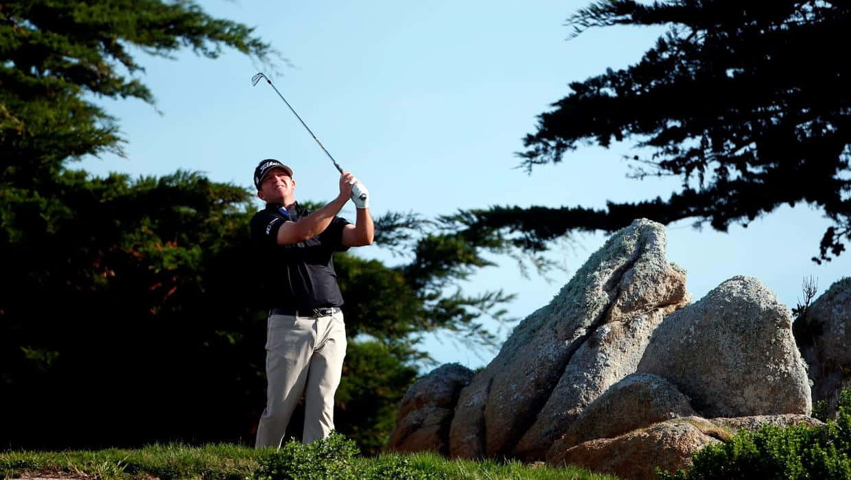 Jason Bohn Beside A Rock Wallpaper