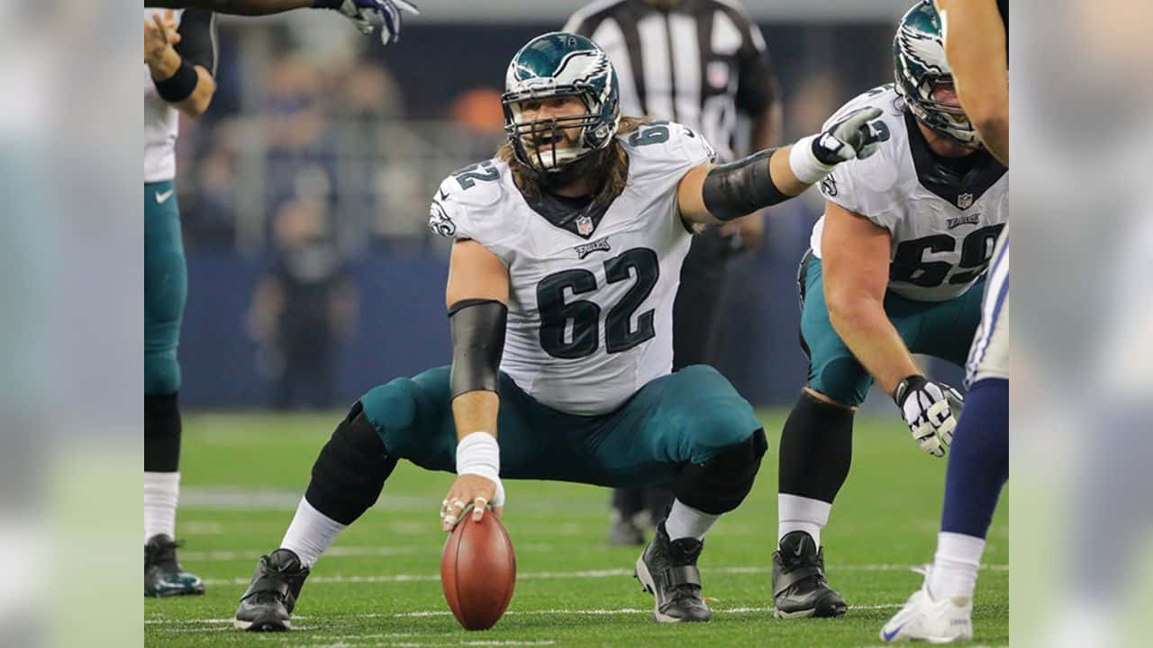 Jason Kelce Confidently Marching Across The Field Wallpaper