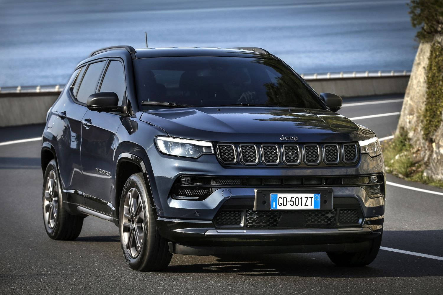 Jeep Compass Dark Blue On Curved Road Wallpaper