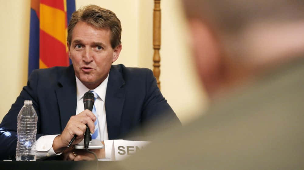 Jeff Flake Talking While Holding Microphone Wallpaper