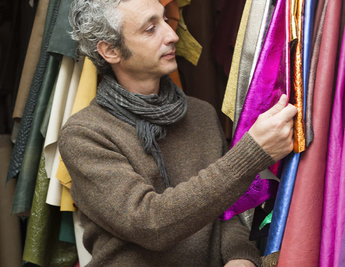 Jérôme Dreyfuss Looking At Fabrics Wallpaper