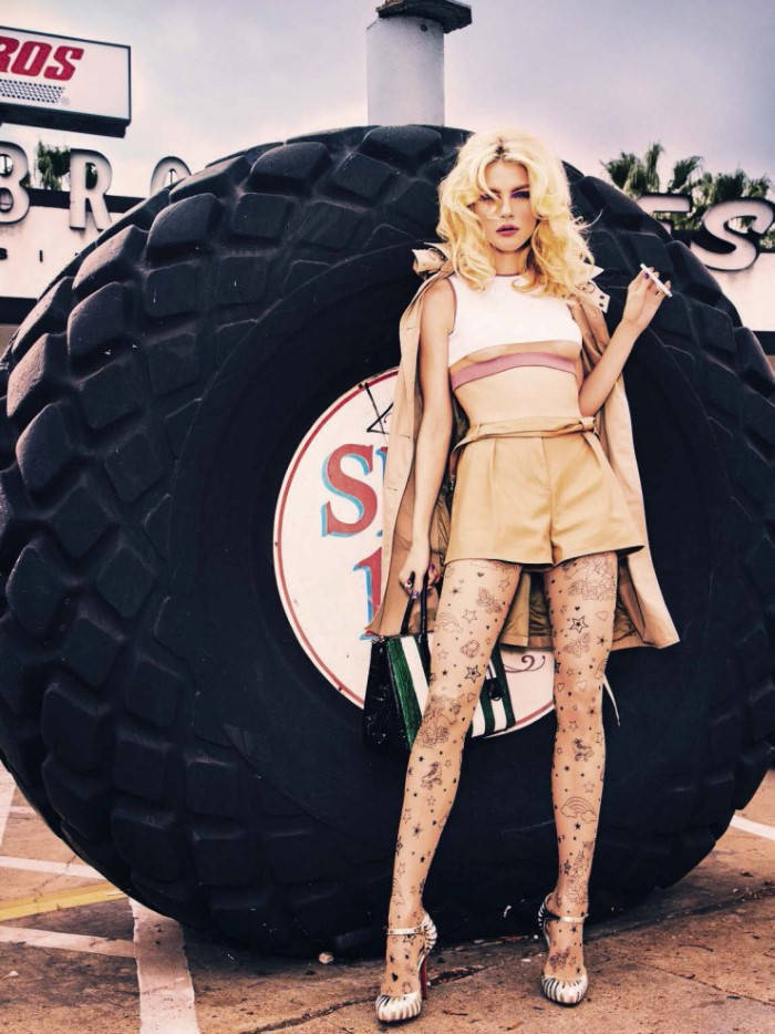 Jessica Stam Posing With Huge Tire Wallpaper