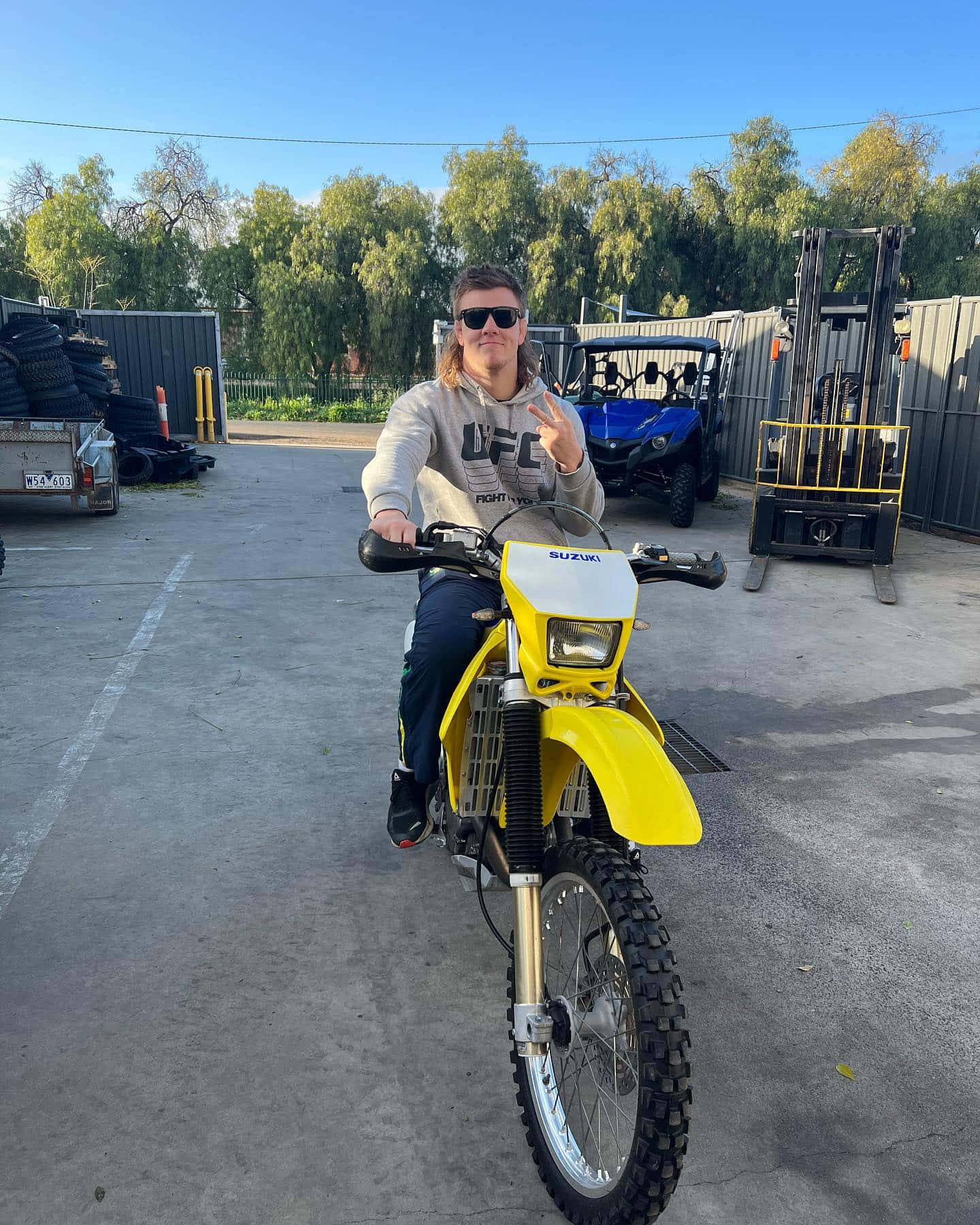 Jimmy Crute On A Yellow Motorcycle Wallpaper