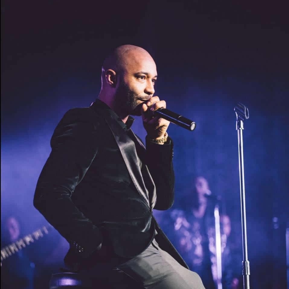 Joe Budden Performingon Stage Wallpaper