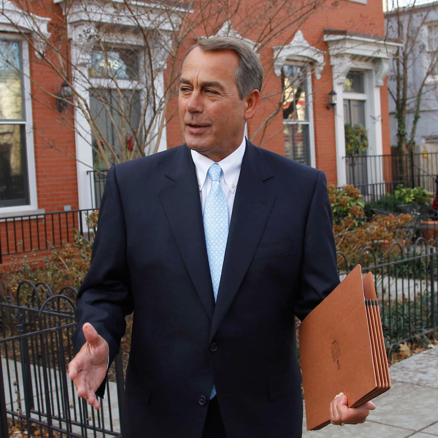 John Boehner Holding Folders At The Office Wallpaper